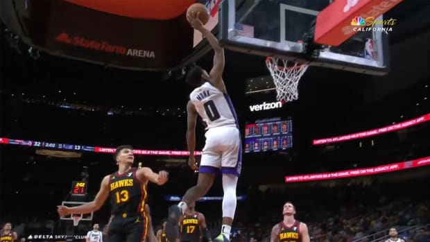 Malik Monk throws down a dunk against the Hawks.